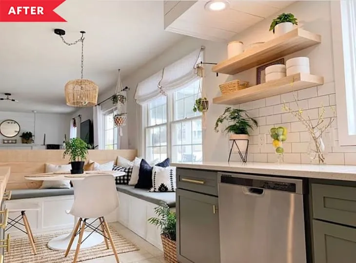 Sunny kitchen with floating wood shelves, plants, white tile and a breakfast banquette