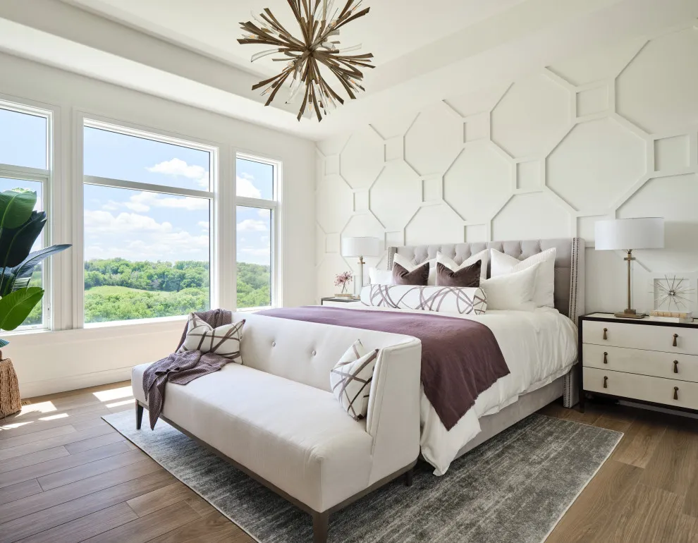 Pale raised hexagonal lines cover the wall behind a light upholstered bed