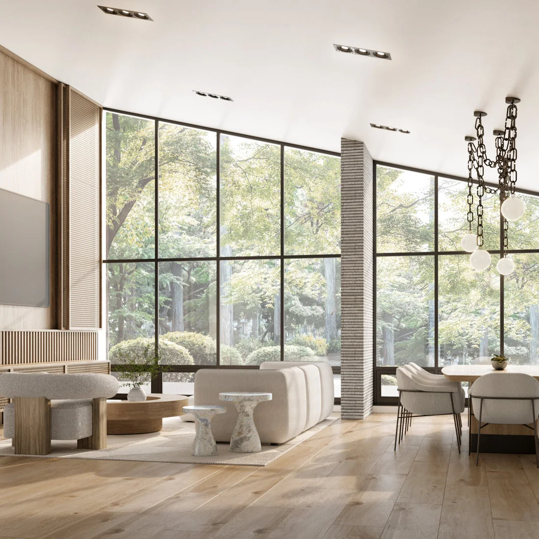 Pale dining chairs and a light table sit under a chain-like globe fixture beside broad black-framed windows, wood flooring and pale living-room furniture