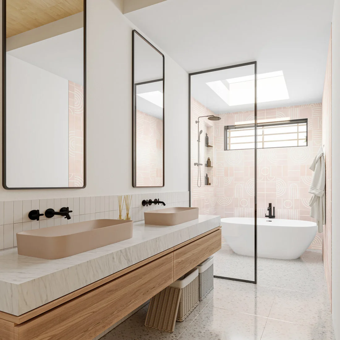 A long wooden vanity with pale rectangular sinks faces a bath area with pink geometric tile and a high window